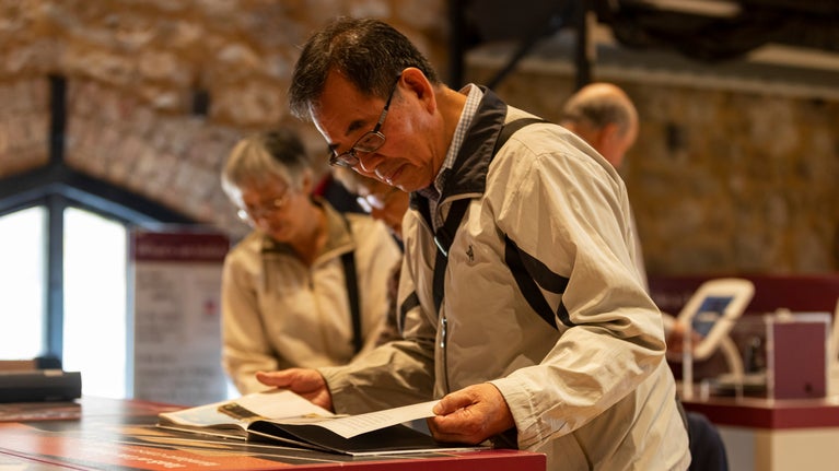 Visitors on a tour of the Royal Oak Conservation Studio at Knole, Kent